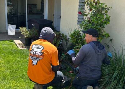 Plumber checking sewer blockage through camera